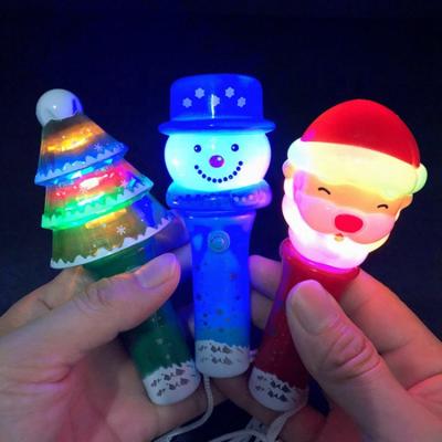 China Kanlong Baby Christmas Flashlight On/Off Toys Led Santa Tree Snowman Light Magic Rotating Christmas Light for sale