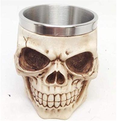 China Factory direct supply creative resin stainless steel skull mug can be used for drinking whiskey, red wine, beer cups. for sale