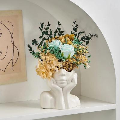 China Hot Selling Creative Sculpture Abstract Body Art Plant Flower Pot Home Decor White Vase Human Face Ceramic Flower Vase for sale