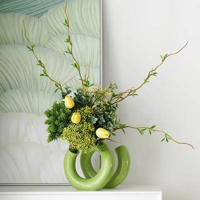 China Elegant Hollow Donut Flower Vases Lovely Twist Pipe Shape Ceramic Vase For Home Decor for sale