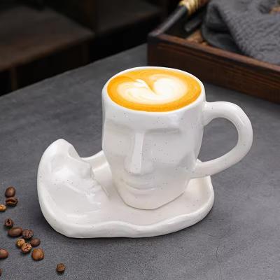 China New Product Ideas 2022 Nordic Creative Face Shape Porcelain Cup and Saucer Set Artistic Kiss Cup Ceramic Coffee Cup Set for sale