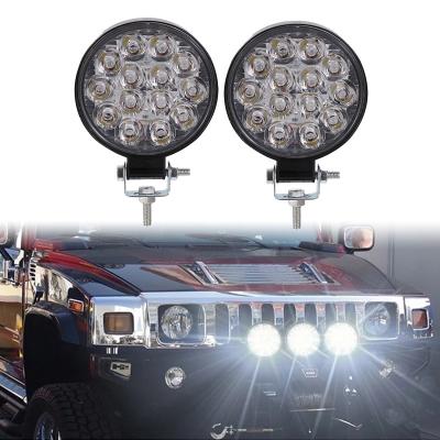 China Modified Car drl NUYAO 14 LED Truck Circular Spot Fog Lights 42W 12V Laser Work Waterproof Round Light For SUV Truck Offroa for sale