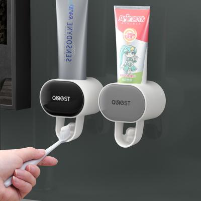 China Sustainable Fully automatic toothpaste squeezer set wall-hanging toothpaste-free toothbrush storage rack Toothpaste rack lazy squeezer for sale