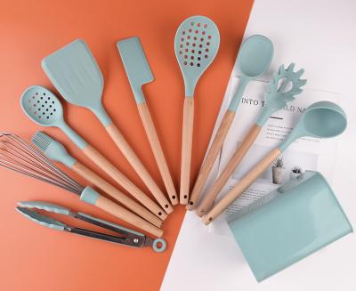 China Amazon Sustainable Hot Sale New Utensils 11 Pcs Silicon Kitchenware With Wooden Handle for sale