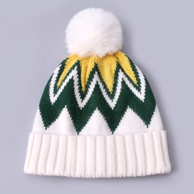 China Custom Embroidered Beanies Winter Knitted Stripe Patterned Warm Soft Pompom Puff Print Beanie Manufacturer for sale