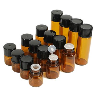 China Amber Essential Oil Bottles 1ml 2ml 3ml Mini Sample Vial 5ml Glass Cosmetic Empty Bottle with Orifice Reducers and Black Lids for sale