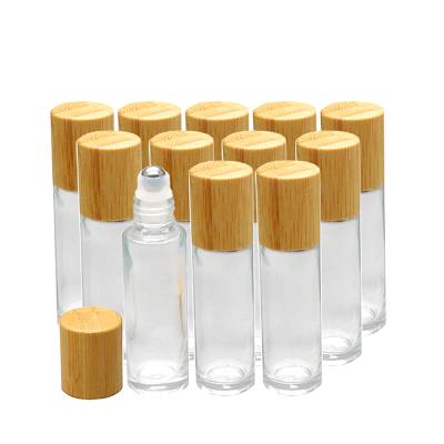 China Essential Oil Cosmetic Glass Roll On Bottles Refillable Perfume 10ml Sample Vial 5ml Roll On Bottle With Bamboo Lid for sale