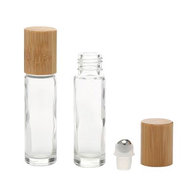 China Wholesale 5ml 10ml Cosmetic Glass Essential Oil Roll On Sample Bottle Perfume Bottle With Stainless Steel Ball And Bamboo Lids for sale