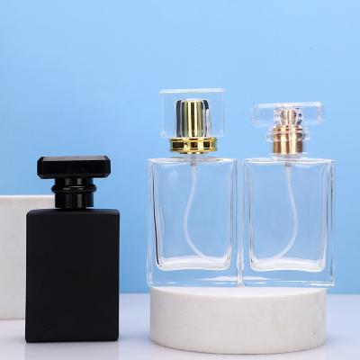 China Clear Black Perfume Spray Bottle Square 30ml 50ml 100ml Cosmetic Refillable Empty Glass Perfume Bottle With Spray Applicator for sale