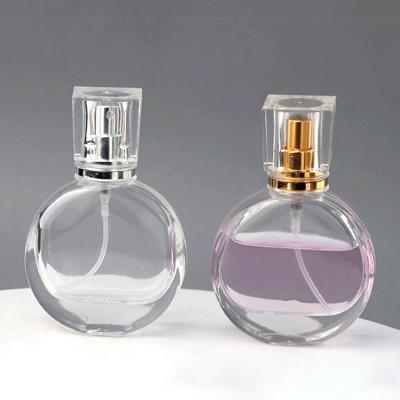 China Cosmetic Refillable Spray Perfume Bottle 25ml High Clear Glass Empty Perfume Atomizer Bottle With Acrylic Cap for sale