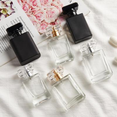 China Cosmetic 30ml Perfume Bottles Silver Clear Black 50ml 100ml Empty Fine Mist Perfume Spray Bottle With Acrylic Cap for sale