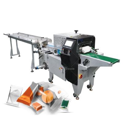 China 400KG Weight Multi-Function Chocolate Foil and Paper Wrapping Machine with Conveyor for sale