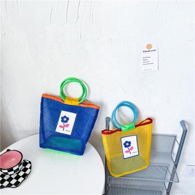 China Modern Fashion Fresh Children's Bags Summer Mesh Handbag Fashion Hollowed-out Bridesmaid Tote Holiday Photo Net Beach Bag Small for sale