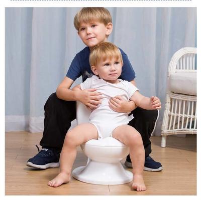 China PP Plastic Simulation Flushing Toilet Baby Potty Training Seat With Solid Pattern Type for sale