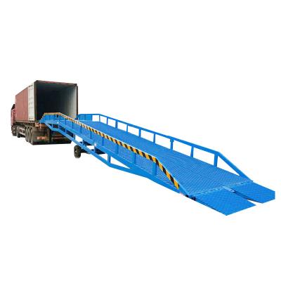 China Hotels CE Approved Automatic Hydraulic Cylinder Motorized Concrete Pit Hinged Heavy Duty 15t Dock Leveler For Warehouse Dock for sale