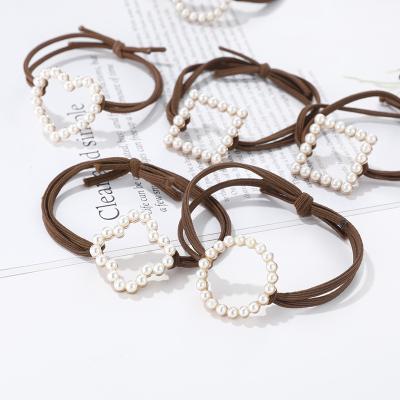 China Simple Geometric Trend Hair Band Of An Environmentally Friendly Korean Hair Rope Pearl Hair Band Elastic Band for sale