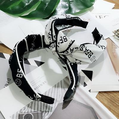 China New Fashion Soft Edge Letter Printing Clip Hairband Wide Knot Friendly Material For Women for sale