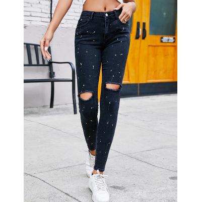 China Lady Jeans Hand Made QUICK DRY White Spots Mid-Waisted Holes Pencil Jeans For Women for sale