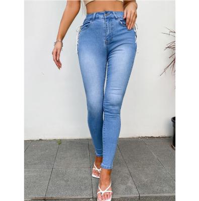 China QUICK DRY Blue Slim Leg Mid Jeans With Strap On Side High-Waisted Jeans for sale