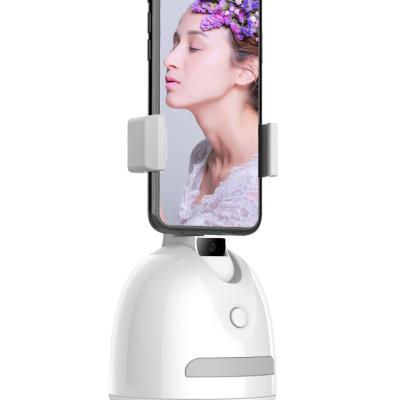 China Amazon Hot Selling 2022 Plastic Auto 360 Rotation Face/Body Radio Tracking Camera Shooting Mobile Phone Auto Tracking Smart Holder for sale