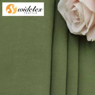 China Pure Lenzing Ecovero Green Plain 30S 120GSM Rayon Fabric Wholesale High Quality Solid And Print For Dress for sale