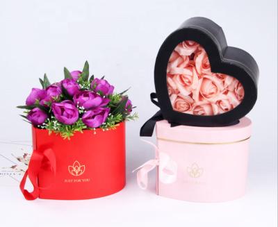 China Custom Design FSC Ribbon Closure Professional Heart Shaped Double Rotating Flower Packaging Gift Box With Purse, 18pcs/Carton for sale