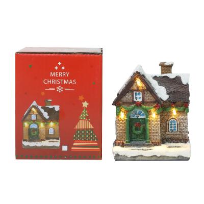 China Europe 2021 New Luminous Small House Ornaments Christmas Ornaments Resin Snow House Christmas Gifts for sale