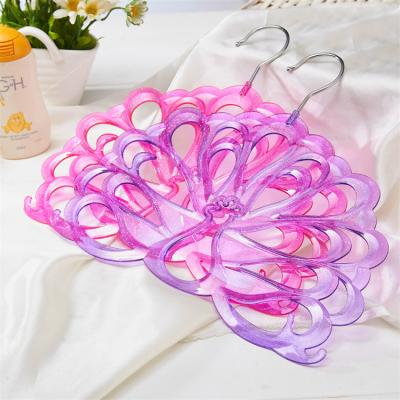 China Space saving porous peacock shape plastic hangers wholesale fashion wide plastic shoulder hanger for kids for sale