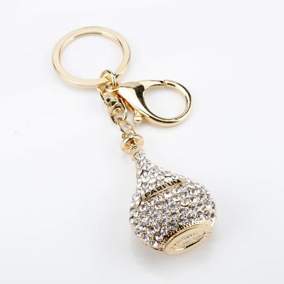 China Blink Style Perfume Bottle Key Chain Crystal Fashion Women Souvenir Car Bag Key Chain Pendant for sale