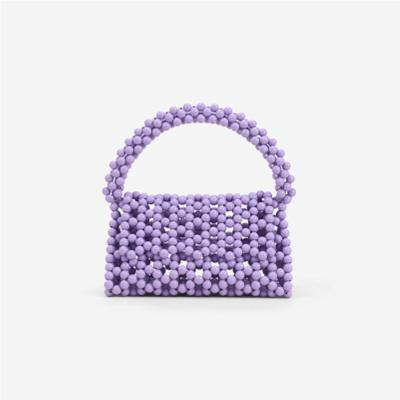 China High quality hollow three-dimensional handmade beaded armpit bag acrylic hand - woven bag beaded 2021 new woven portable underarm bag for sale