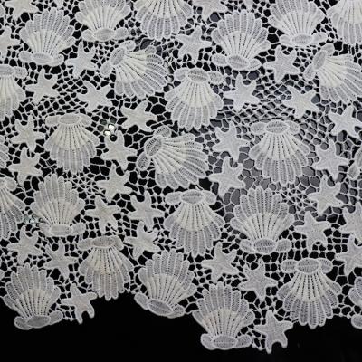 China Shrink-resistant white star and shell desgin polyester fashion lace fabric embroidered fabric for ladies' dress for sale