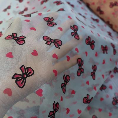 China Shrink-Resistant Hot Selling Organza Pink Bow Printed For Dance Skirt Organza Fabric for sale