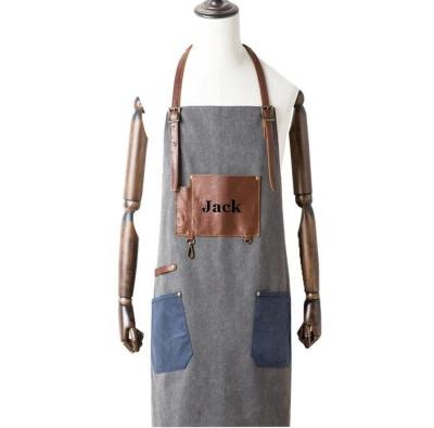 China Bartender 2022 Adjustable Canvas Cross Leather Strap Tidy/Storage MYGO 12OZ Apron Custom Logo Uniform Barbershop Barber Apron for sale