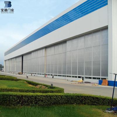 China modern industrial sectional door/east asia's largest hangar sliding door/hydraulic hangar door for sale