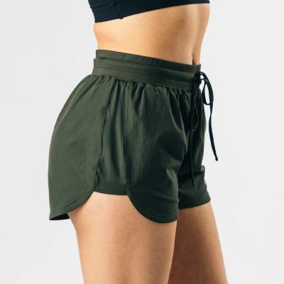 China QUICK DRY Sporty Running Fitness Performance Single Empty Gym Workout Shorts Women Woven Sports Yoga Shorts for sale