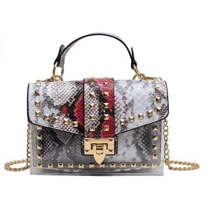 China Wholesale fashion snake print ladies rivet shoulder bag graffiti jelly bag PVC transparent bag for sale