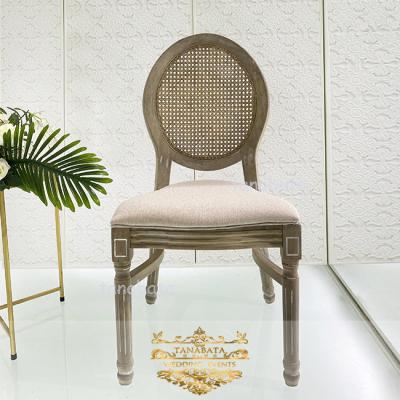 China Modern Round Back Wooden Rattan Cane Event Chairs For Weddings for sale