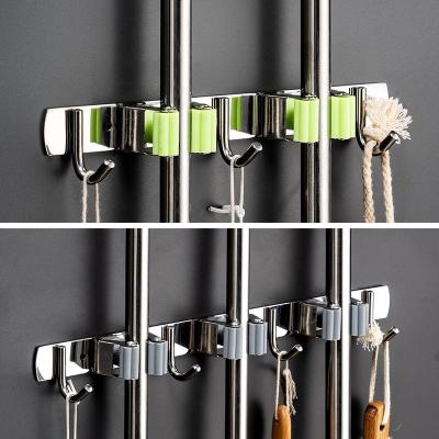 China Durable Home Storage Using Household Broom Holder Stainless Steel Mop Holder Glossy Adhesive for sale