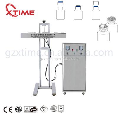 China Automatic Food Bottle Induction Sealing Machine Aluminum Foil Sealing Machine for sale