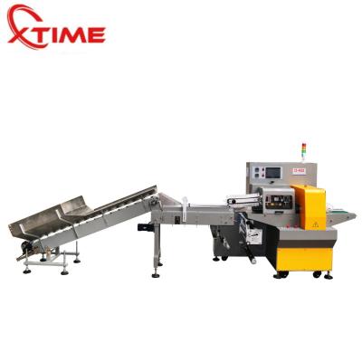 China XTIME Food Packing Machinery High Speed ​​And Quality Pillow Packaging Machine For Packing Fruits for sale