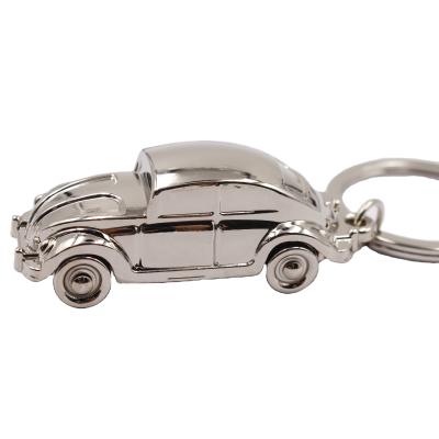 China Fashion Metal 3d The Shape Movable Car Beetle Key Ring Wheel Car Key Chain for sale