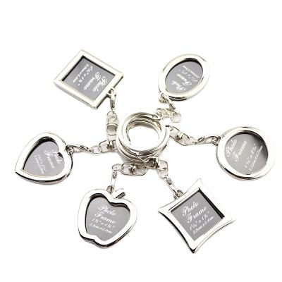 China Metal Round Rotate Photo Zinc Alloy Silver Frame Metal Keychain DIY Gifts Metal Key Chain for sale