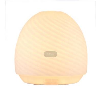 China Household 5565 Capacity 200ML Atomization Humidifying Essential Oil Night Light 3d Warm Light Glass Aromatherapy Machine for sale