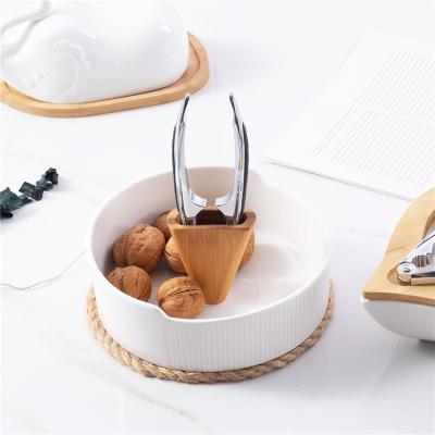 China Sustainable Wholesale White Ceramic Dish Household Nut Bowl With Clip for sale