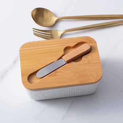 China Stored In Stock Rectangular Ceramic Bamboo Lid Large Butter Stock White Ceramic Dish Butter Container With Knife for sale