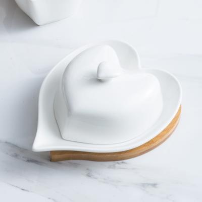 China Heart Shape Butter Keeper Butter Dish Tableware Cheese Butter Stored Ceramic Container Set Bamboo Tray With Lid for sale