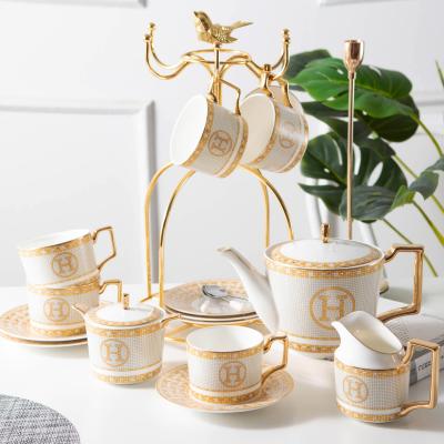 China Customized Viable Design Gold Ceramic Tea Set Luxury White Color Bone China Mug With Teapot Coffee Set for sale