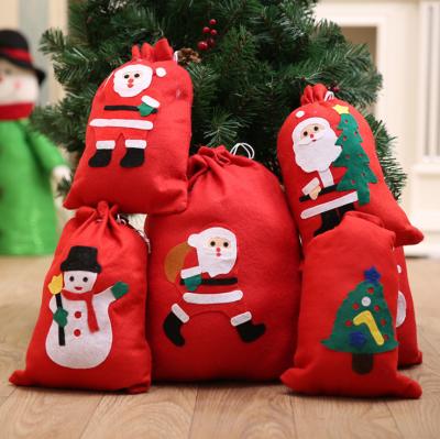 China Microfiber Non Woven Fabric Drawstring With Santa Decal Handmade Gift Bag for sale