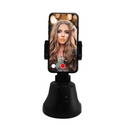 China Newest Smart Selfie Robot Cameraman Movil Adjustable Auto Shooting Tracking Phone Holder for sale