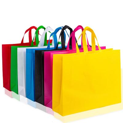 China Stock Low MOQ 100pcs Handled Shopping Bag Storage Outdoor Travel Handbags Market Non Woven Bag For Custom Logo for sale